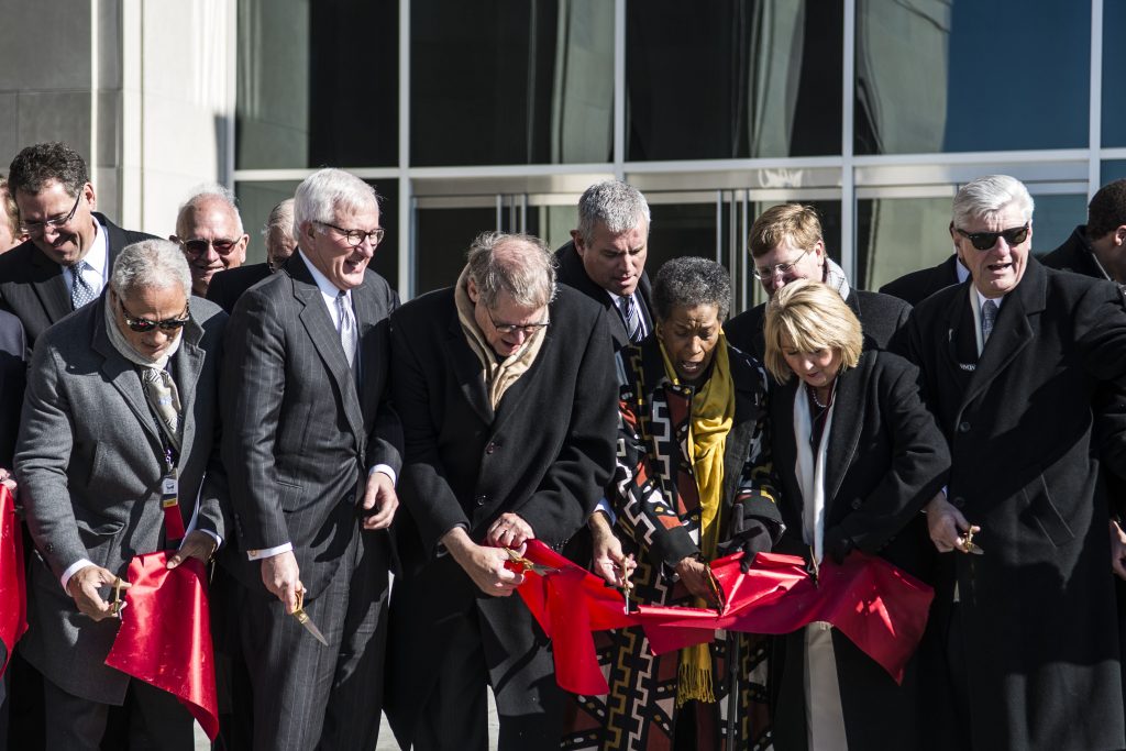 Gov. Phil Bryant, former governors William F. Winter and Haley Barbour, Myrile Evers, Katie Blount, and many others cut the ribbon in front of the new Two Mississippi Museums