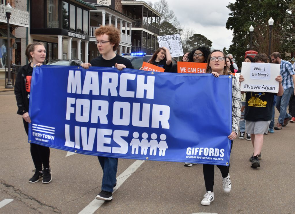 Students leaders, who spoke at and helped organize the March for Our Lives Oxford, lead the hundreds of people marching around the Square Saturday morning. 