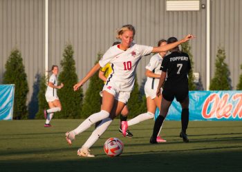 Lauren Montgomery passes the soccer ball