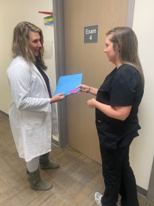 A doctor talks to a nurse