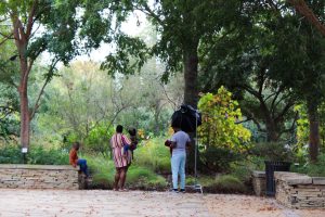 A family takes pictures at the Art Garden