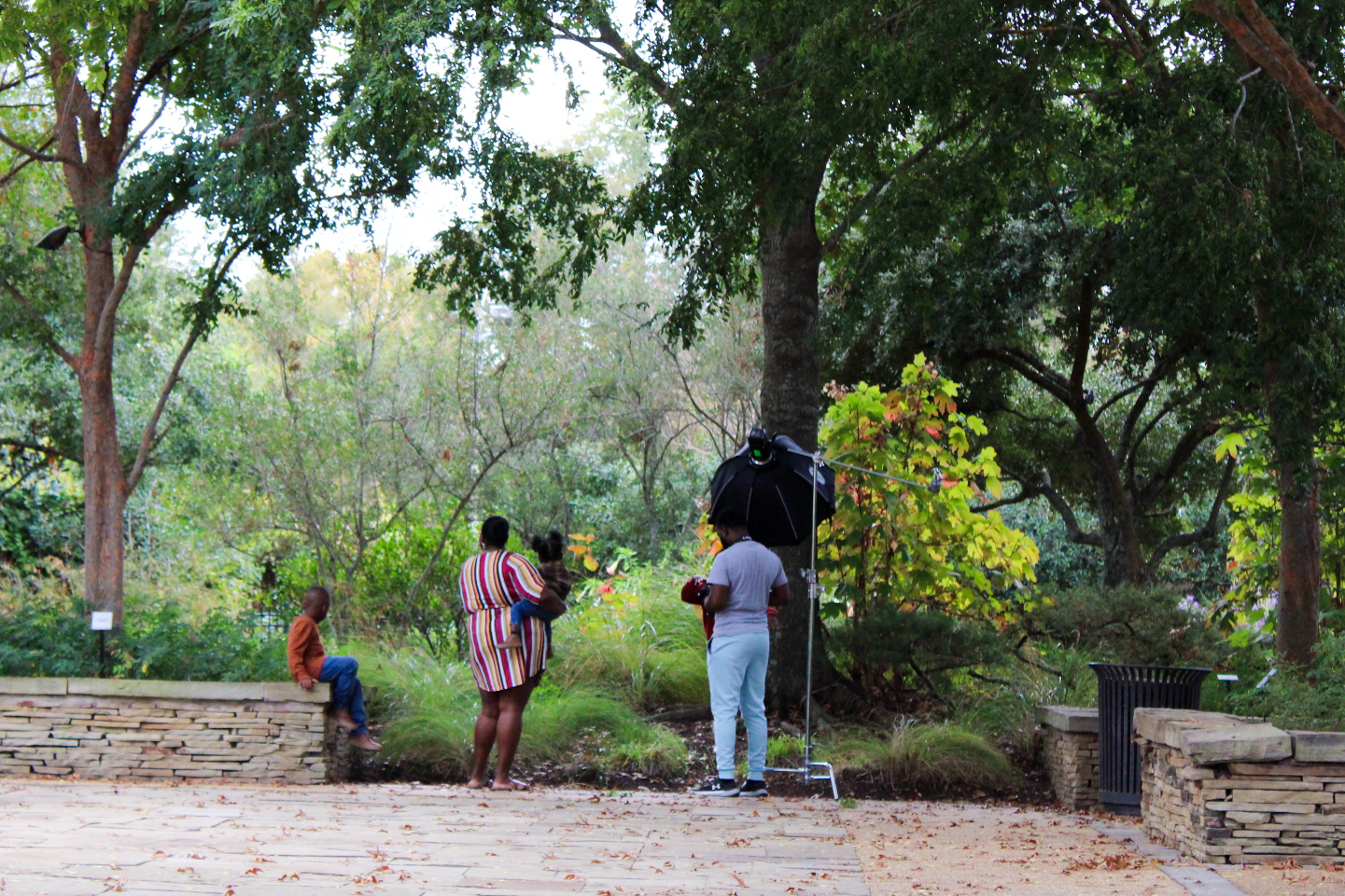 A family takes pictures at the Art Garden