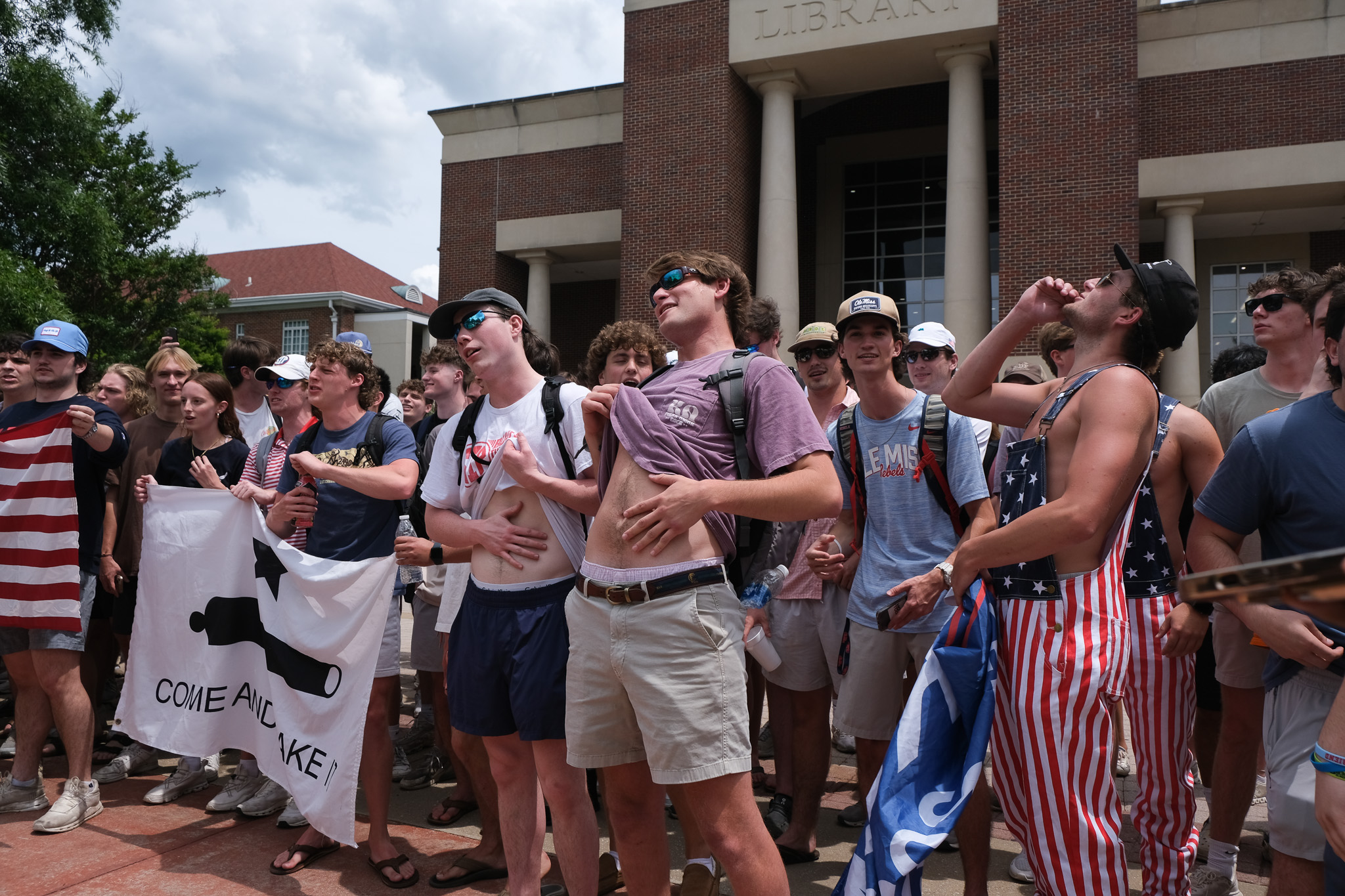photo of university of mississippi students with 'trump won' flag is altered | fact check